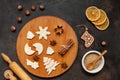 Close-up of workplace with flour and traditional spicy ginger dough for gingerbread and cookies on wooden round board. Merry Royalty Free Stock Photo