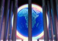 Close up of world globe behind bars