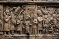 close-up of worn stone carving, depicting life and rituals of long-lost civilization