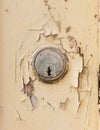 Yale lock on an old wooden door with flaking paint. UK Royalty Free Stock Photo