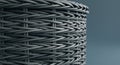 Close-up of a woven basket made from gray synthetic material. The uniform, tight Royalty Free Stock Photo