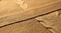 Close-up of woven brown fabric with detailed texture and stitching Royalty Free Stock Photo