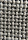 Close-up of woven fabric displaying an interlaced pattern. Grey threads intersect both Royalty Free Stock Photo