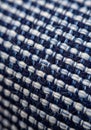 Close-up of a woven fabric featuring a checkered pattern in shades of blue and white Royalty Free Stock Photo