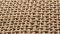 Close up of a woven fabric pattern featuring intertwined beige Royalty Free Stock Photo