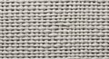 A close-up of a woven fabric showcases an intricate basket weave pattern. The Royalty Free Stock Photo