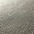 Close-up of a woven fabric with tightly interlaced threads creating a dense texture. Royalty Free Stock Photo