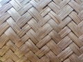Close-up of a woven pattern featuring interlaced strips of a natural material, likely reed or bamboo Royalty Free Stock Photo