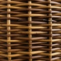 A close-up of a woven wicker texture features interlacing strands of light and dark Royalty Free Stock Photo