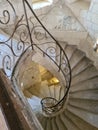 Close up of wrought iron handrail of medieval stone spiral staircase Royalty Free Stock Photo