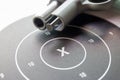 Close up ` x ` on bullseye paper shooting target with blurred si Royalty Free Stock Photo