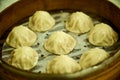 Close-up of the Xiao Long Bao or soup dumpling in bamboo steamers.