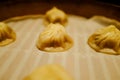 Close-up of the Xiao Long Bao or soup dumpling in bamboo steamers.