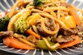 close up of yakisoba in black plate with white details Royalty Free Stock Photo