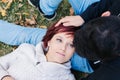 Close-up of a 20-year-old Caucasian girl, with fair skin, short red hair and pretty green eyes, relaxing with her boyfriend Royalty Free Stock Photo