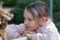 close-up 8-9 year old girl, blonde looks thoughtfully Royalty Free Stock Photo