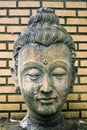 Close-up 400 years old of ancient head stone buddha statue at hi