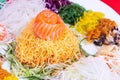 Close-up of Yee Sang or Yusheng with raw salmon fish