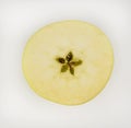Close-up of a yellow apple cut in half. Royalty Free Stock Photo
