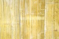 Yellow bamboo wood wall texture with seamless vertical patterns on background Royalty Free Stock Photo