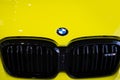 close-up yellow BMW 5-door petrol crossover model X3 M in Studio, Exterieur vehicle in showroomr, German brand automotive