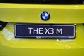 close-up yellow BMW 5-door petrol crossover model X3 M in Studio, Exterieur vehicle in showroomr, German brand automotive