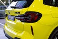 close-up yellow BMW 5-door petrol crossover model X3 M in Studio, Exterieur vehicle in showroomr, German brand automotive