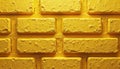 Close-up of a yellow brick wall texture. Rough golden blocks are stacked tightly together forming a solid surface. This Royalty Free Stock Photo