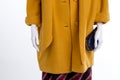 Close up yellow cashmere coat for women. Royalty Free Stock Photo