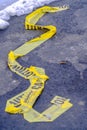 Close up of a yellow Caution tape on a road in Eagle Mountain Utah