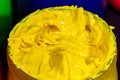 .close up yellow color of ink for print tee shirt..close up the yellow paint in the glass bucket.the yellow of plastisol ink for p Royalty Free Stock Photo