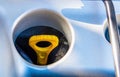 Yellow dipstick oil in a car engine Royalty Free Stock Photo