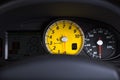 Close up of yellow Ferrari speedometer