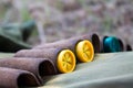 Close up on yellow and green bullets in hunter jacket Royalty Free Stock Photo