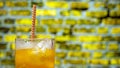 Close-up of yellow lemonade on a racy brick wall background. Summer drink with ice, orange juice Royalty Free Stock Photo