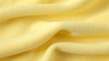 Close up of a yellow microfiber cloth texture - studio shot. Close-up texture of light fur. Abstract background and texture for Royalty Free Stock Photo