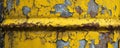 Close-up of a yellow peeling paint on a rusty metal barrel, texture and decay concept Royalty Free Stock Photo