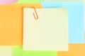 close up yellow post it with colorful notes with orange paper clip have copy space Royalty Free Stock Photo