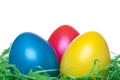 Close-up of yellow, red, blue Easter Eggs in nest