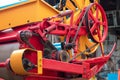 Close-up of the yellow and red combine harvesters