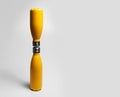 Close-up of yellow reusable water bottles on grey background with copy space.Close-up of yellow reusable water bottles on grey. Royalty Free Stock Photo