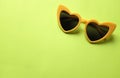 Close up  yellow sunglasses isolate on a green background Royalty Free Stock Photo