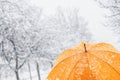 Close up of yellow umbrella in snow Royalty Free Stock Photo