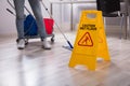 Close-up Of Yellow Wet Floor Caution Sign Royalty Free Stock Photo