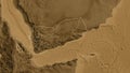 Shape of Yemen with regional borders. Sepia elevation. Royalty Free Stock Photo