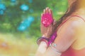 Close up of yoga woman hands in namaste gesture with rose flower Royalty Free Stock Photo