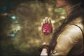 Close up of yoga woman hands in namaste gesture with rose flower