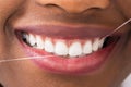 African Woman Flossing Teeth Royalty Free Stock Photo