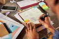 Back view of african american woman writing weekly schedule on agenda Royalty Free Stock Photo