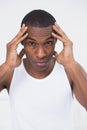 Close up of a young Afro man suffering from headache Royalty Free Stock Photo